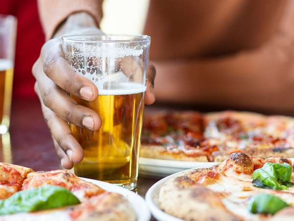 Guests enjoying a variety of pizzas and beers at Black Pizza in Atlanta. 