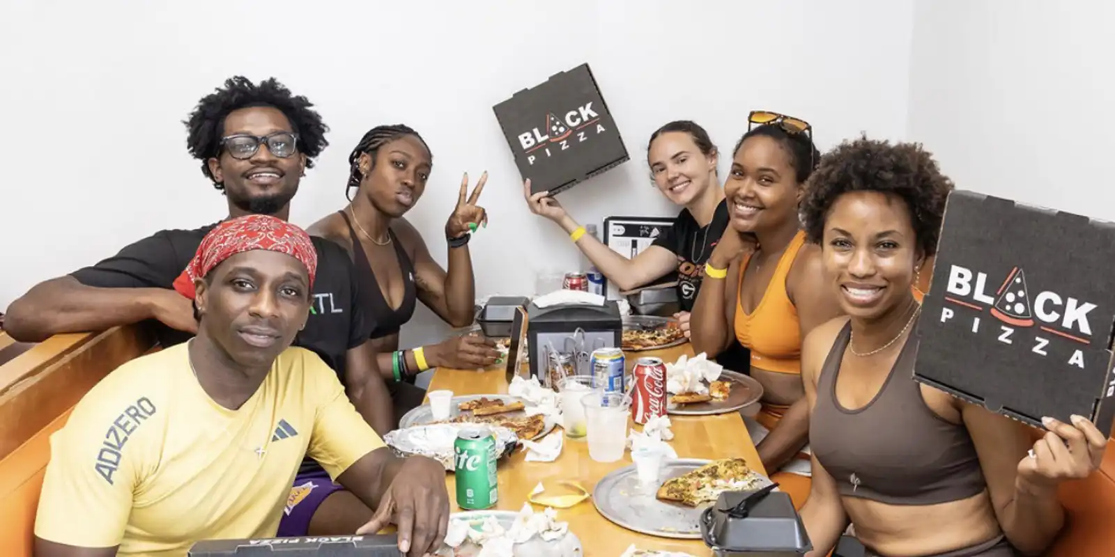 Pizza lovers enjoying some of the best pizza in Atlanta at Black Pizza. 