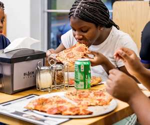 Neighbors and friends enjoying Black Pizza on Joseph E. Boone Boulevard NW in Atlanta. 