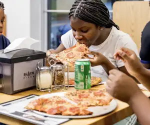 Neighbors and friends enjoying Black Pizza on Joseph E. Boone Boulevard NW in Atlanta. 
